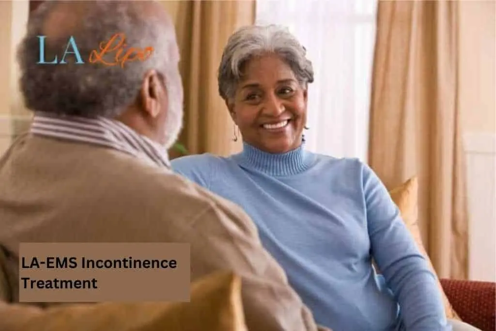 Couple sat smiling at each other - LA-EMS treatment Reigate