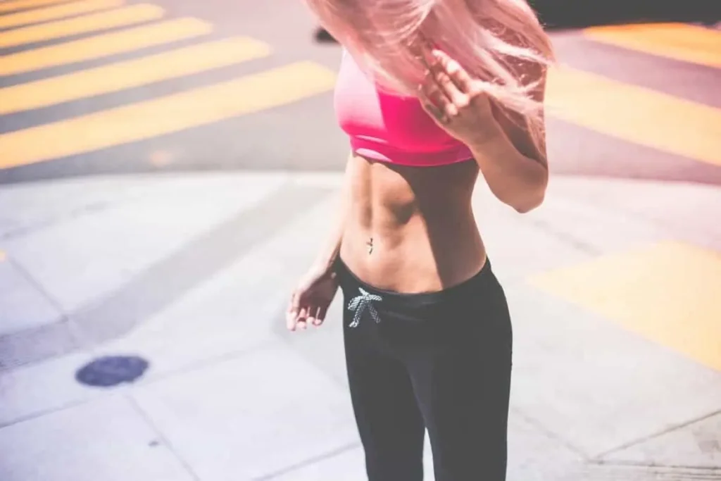 Woman with toned stomach after LA-EMS Body Sculpting Treatment Reigate