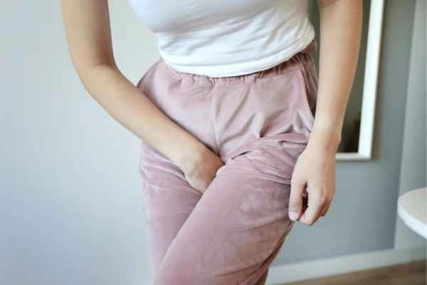 woman running for the toilet because of urinary incontinence Reigate